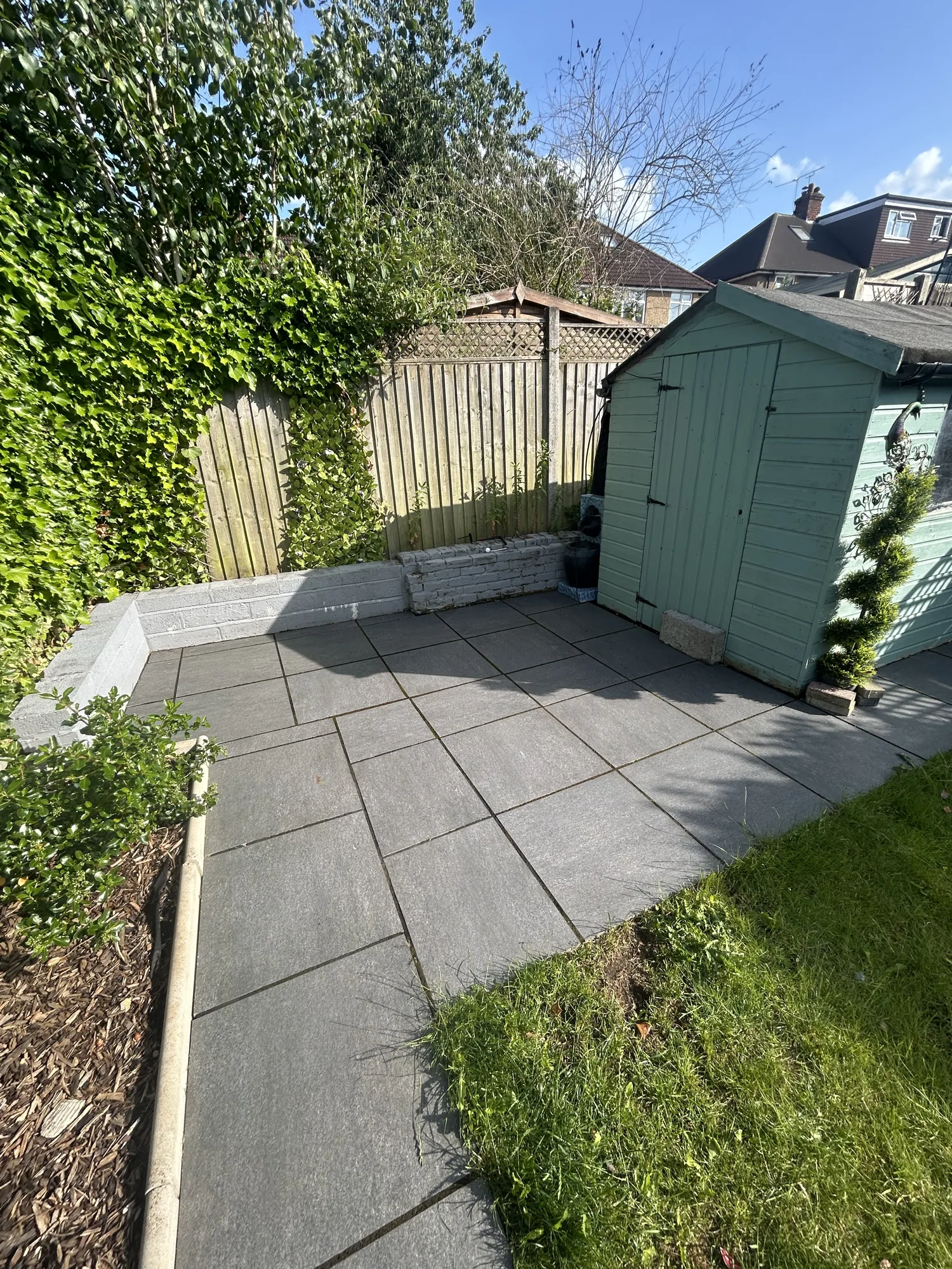 Grey porcelain patio after pressure washing in Rickmansworth
