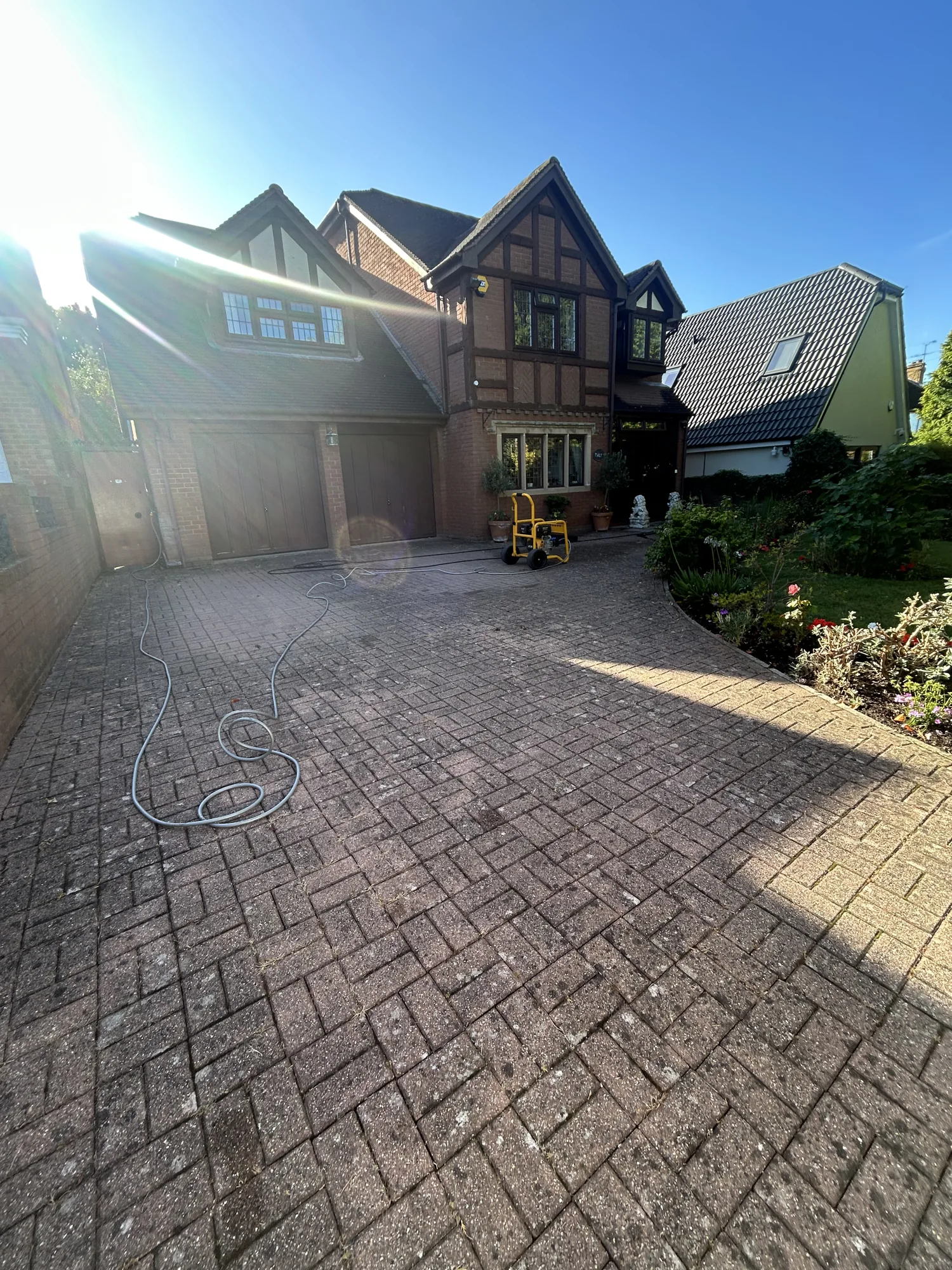 Pressure washing a block-paved driveway in Hertfordshire