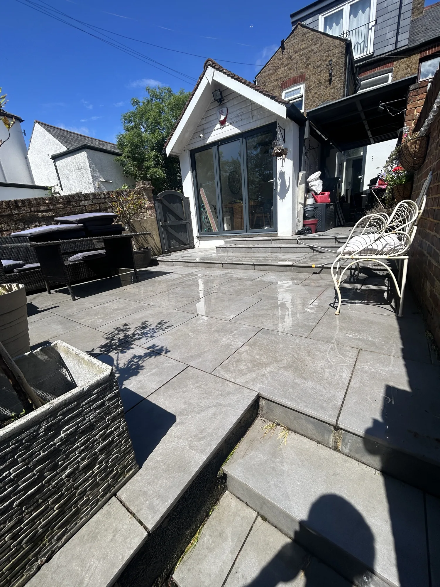Grey porcelain patio after pressure washing in Rickmansworth