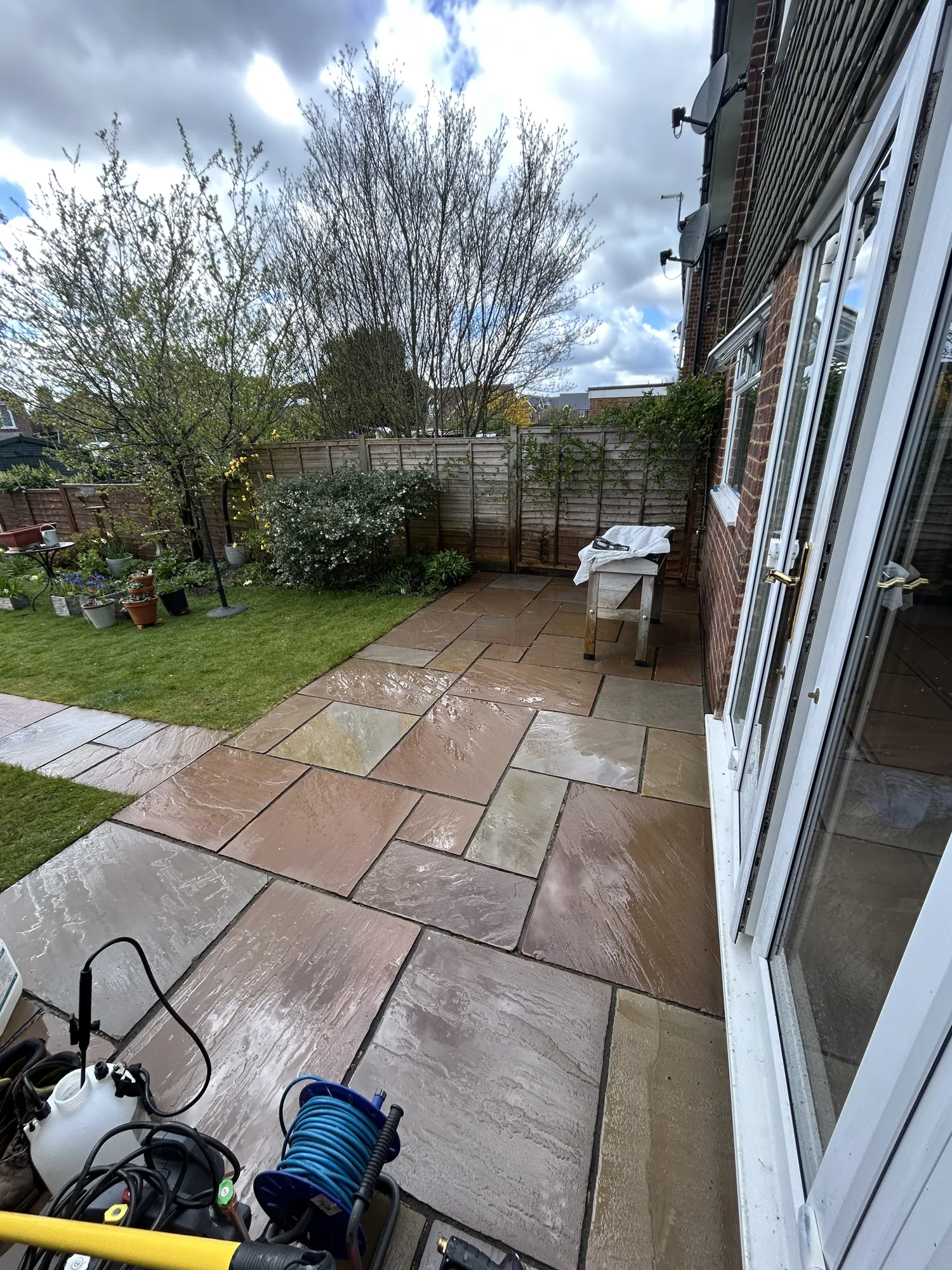 Freshly pressure washed sandstone patio in Hertfordshire