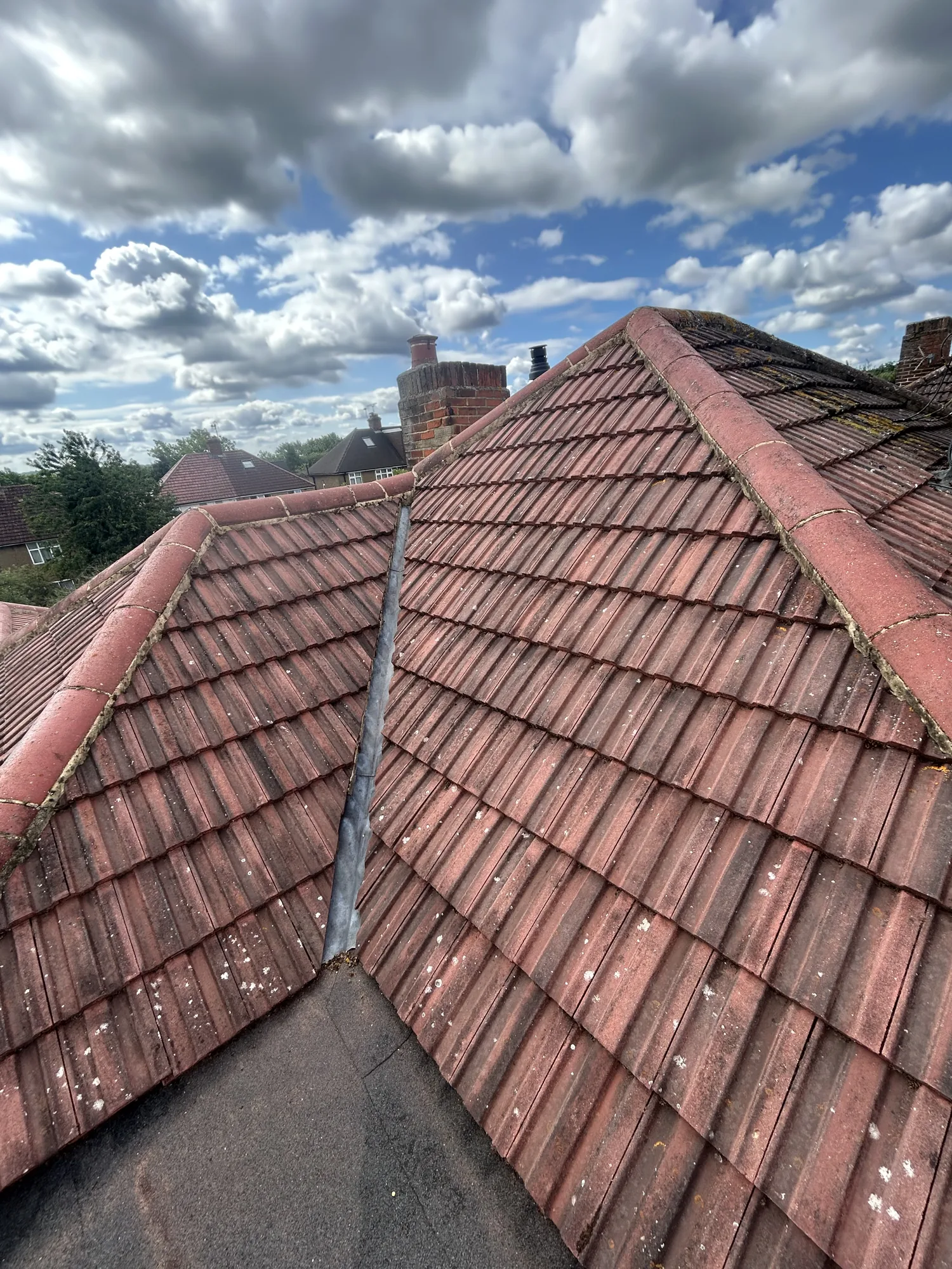 Tiled roof valley cleaned during roof cleaning in Rickmansworth