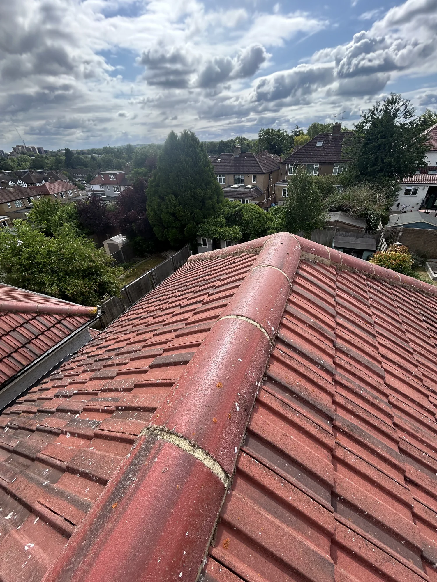 Clean tiled roof ridge after roof cleaning in Rickmansworth